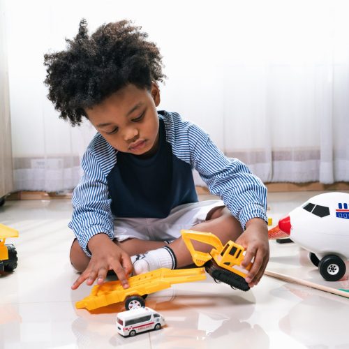 happy-black-people-african-american-child-play-truck-airplane-toy-home-scaled-1_image